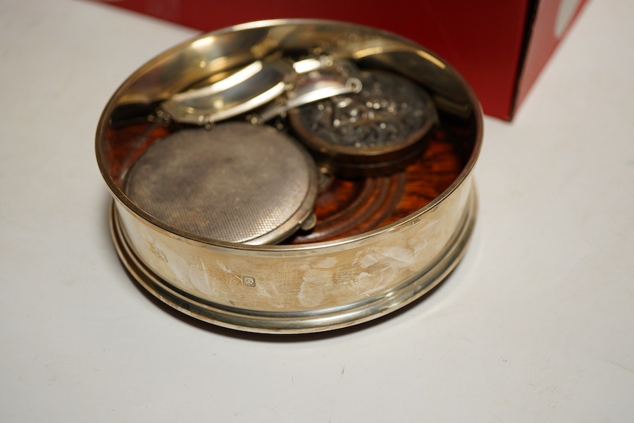 An Elizabeth II silver bottle coaster, London, 1997, M C Hersey & Son Ltd together with a cased set of six bright cut teaspoons, a cased set of pistol grip handled tea knives, a cased silver handled shoe horn and button
